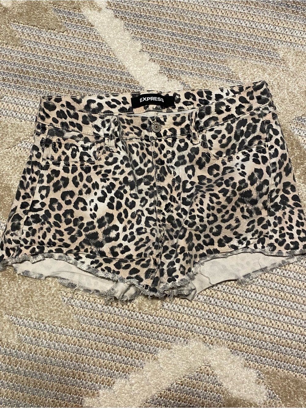 Express Leopard print cutoff shorts
